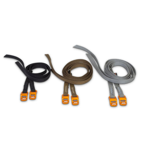 Three sets of coiled straps in black, brown, and grey, each with two bright orange buckles.