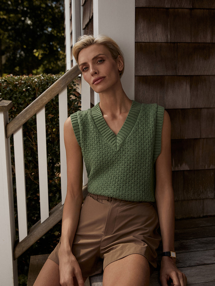 English Ivy|Antonella Knit Vest in English Ivy, crafted from cotton-poly tube yarn in a two-color stitch, with a V-neck and relaxed body that is fitted at the hem.