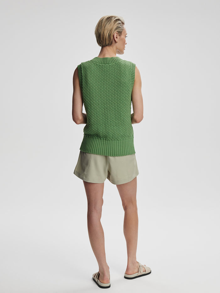 English Ivy|Antonella Knit Vest in English Ivy, front view of a sleeveless knitted vest in dark green.