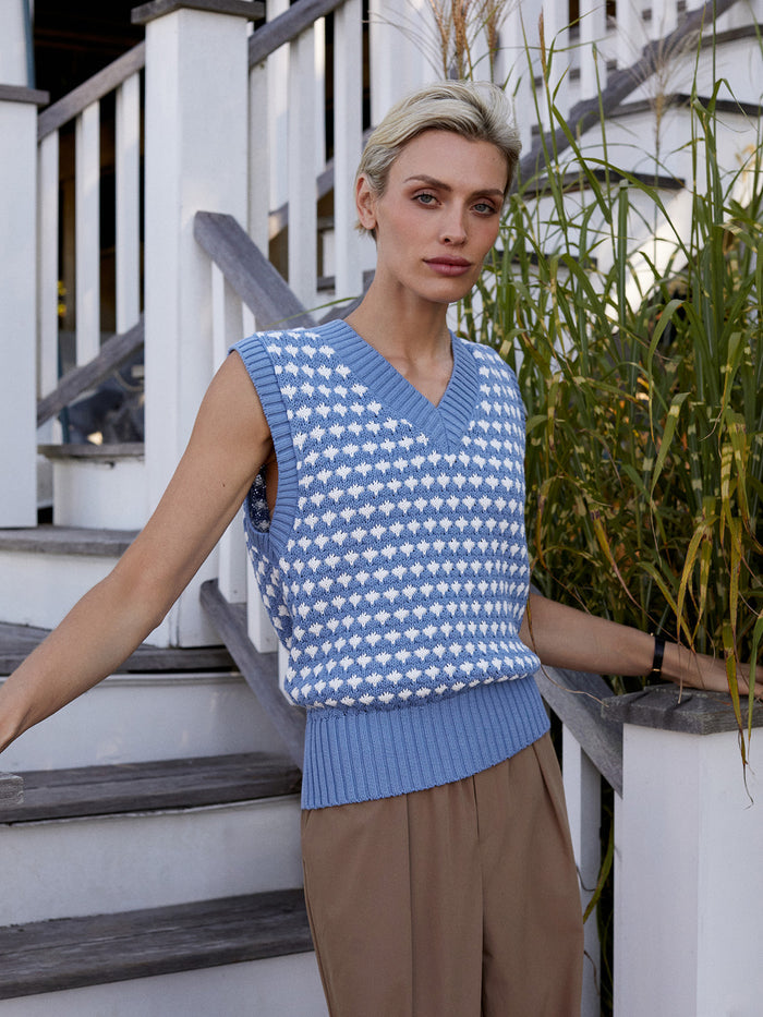 Infinity Blue|Antonella Knit Vest Infinity Blue, front view of a sleeveless knit vest in deep Infinity Blue with ribbed edges for layering.