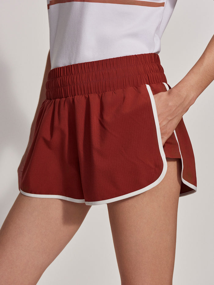 Burnt Henna|Arlington Running Short 2 in burnt henna, Ripstop fabric with curved hem and contrasting binding, internal supportive brief, back waistband pocket.