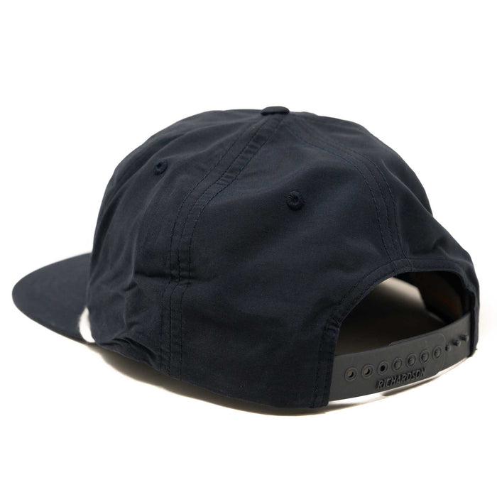 Navy blue baseball cap, rear view, with a black snapback closure featuring "RICHARDSON" text.