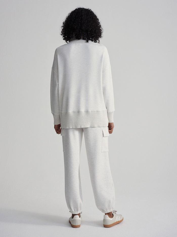 Ivory Marl|Front view of the Barker High Neck Sweat in Ivory Marl, a soft knit pullover with a high neck and relaxed fit.
