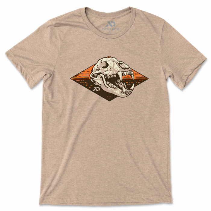 Beige t-shirt with a graphic of a bear skull on a white background