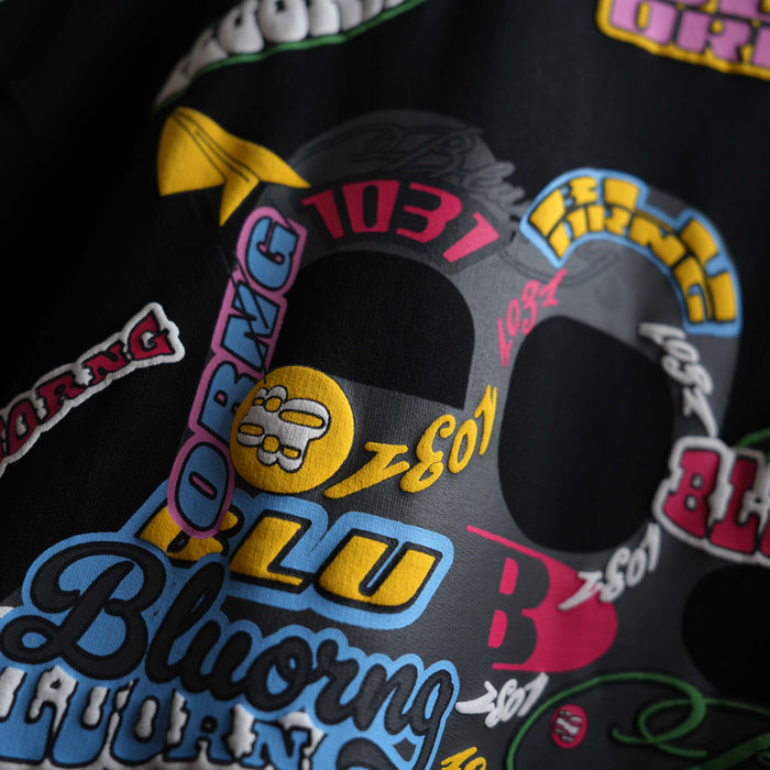 Black high-density puff print t-shirt with sticker slap artwork