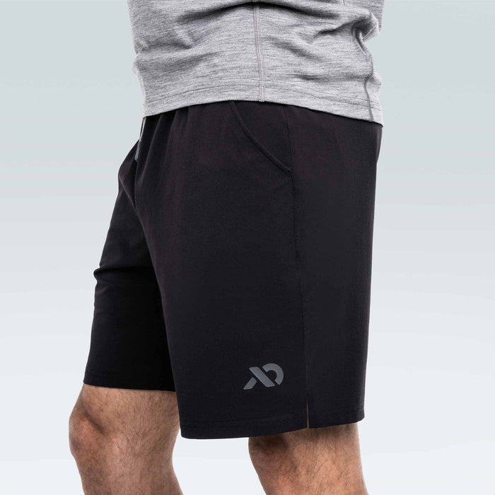 Black athletic shorts with a First Lite logo on a plain background