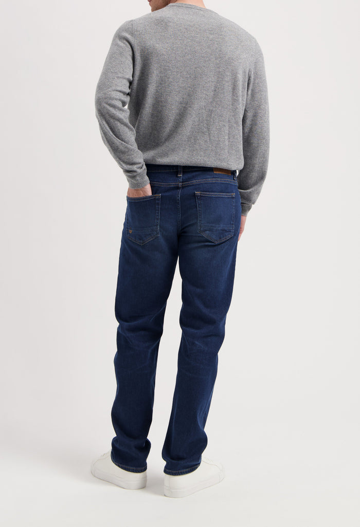 Sustainable MUD Jeans denim jacket in classic blue, crafted ethically with organic materials, paired with matching jeans.