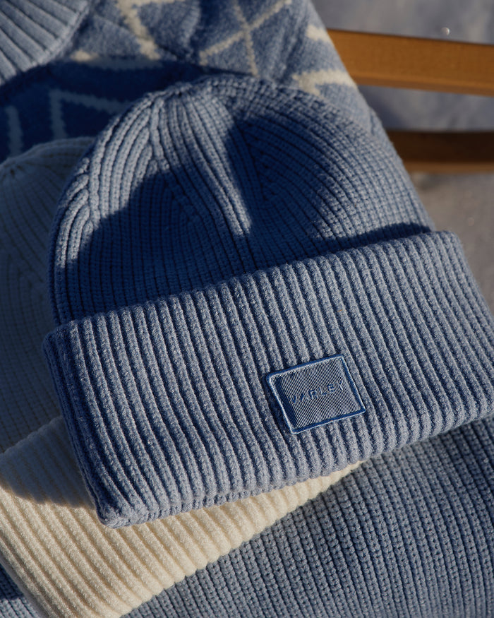 Glacier Blue|Front view of Carly Beanie in Glacier Blue, a knit beanie with a folded cuff, worn by an influencer.