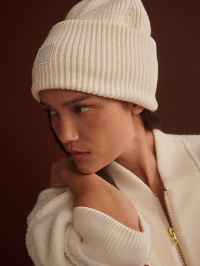 Egret|Front view of Carly Beanie in Egret, a soft knit beanie with ribbed cuff for a cozy fit.