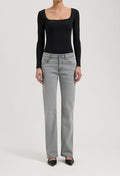 Women's gray straight-leg jeans paired with a black long-sleeve bodysuit, showcasing casual chic fashion style.