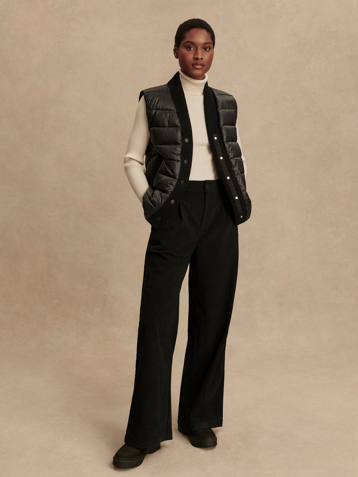 Black|Front view of the Varley Colwyn Combo Boxy Gilet in Black, a sleeveless boxy-fit vest with a high collar, crafted from lightweight shell fabric.