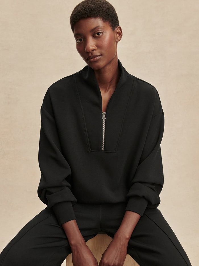 Black|Front view of Davidson Sweat in Black, a subtly cropped top with dropped shoulders and deep cuffs, made in lightweight DoubleSoft® fabric.