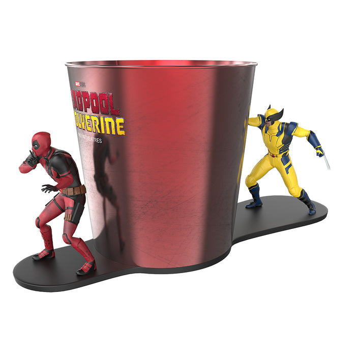 Angled side view of the Deadpool and Wolverine collector tin showing the shape and positioning of the character figures