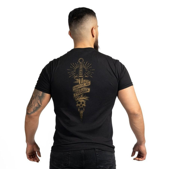 Man wearing a black t-shirt with a gold graphic design on the back, standing against a white background.