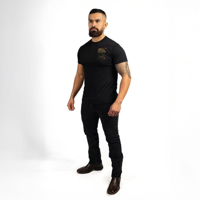 Man wearing a black t-shirt and pants on a white background