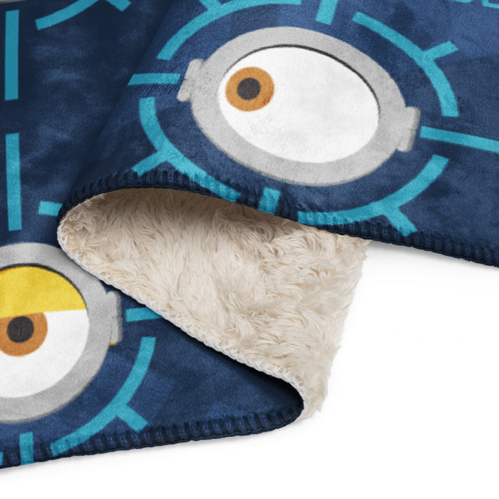 Close-up detail of the ultra-soft sherpa texture showing the printed Minion eye graphic