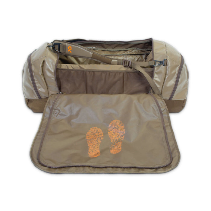 Tan duffel bag with an orange logo on its shoulder strap and two orange contour-line footprint graphics on an unzipped inner flap.