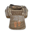 Tan duffel bag with its top open, revealing interior mesh pockets and a front flap featuring two orange topographic footprint designs.