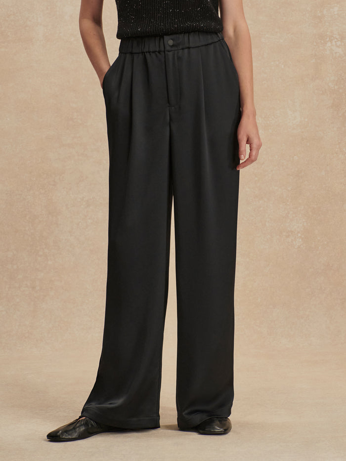 Black|Bryden Wide Leg Pant in Black, size 29.5, front view showing a relaxed, full-length wide-leg silhouette.