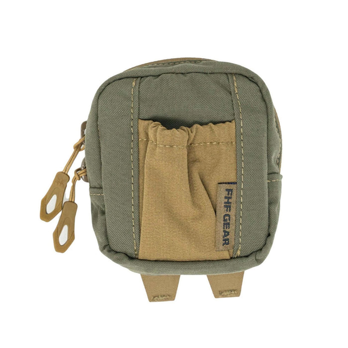 Olive green and tan utility pouch with dual zipper pulls, an elasticized front pocket featuring an FHF GEAR label, and two bottom webbing straps.