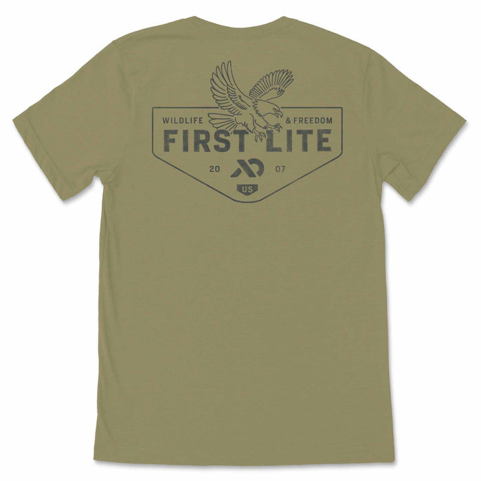 Olive green t-shirt with a dark gray back graphic featuring an eagle above "FIRST LITE" text and "WILDLIFE & FREEDOM".