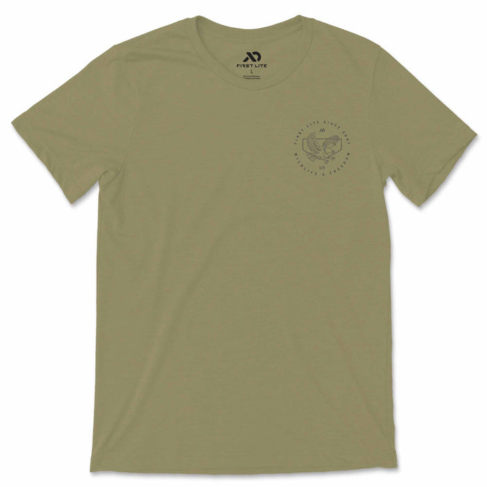 Olive green t-shirt with a circular chest graphic depicting an eagle and the text 'First Lite Since 2007 US Wildlife & Freedom'.