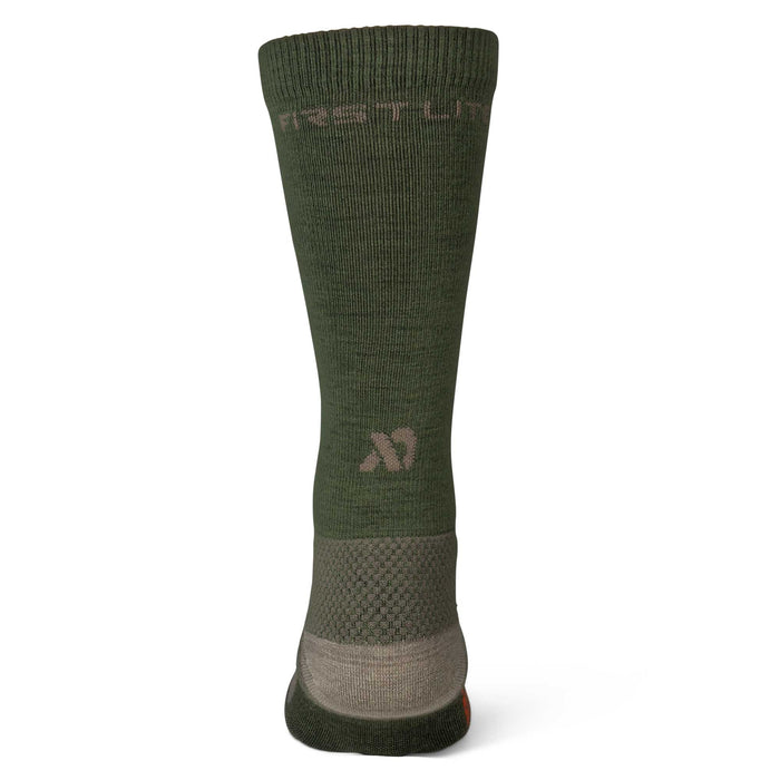 Olive green sock with "FIRST LITE" branding at the cuff, a stylized "M" logo, and a textured tan heel and ankle section.
