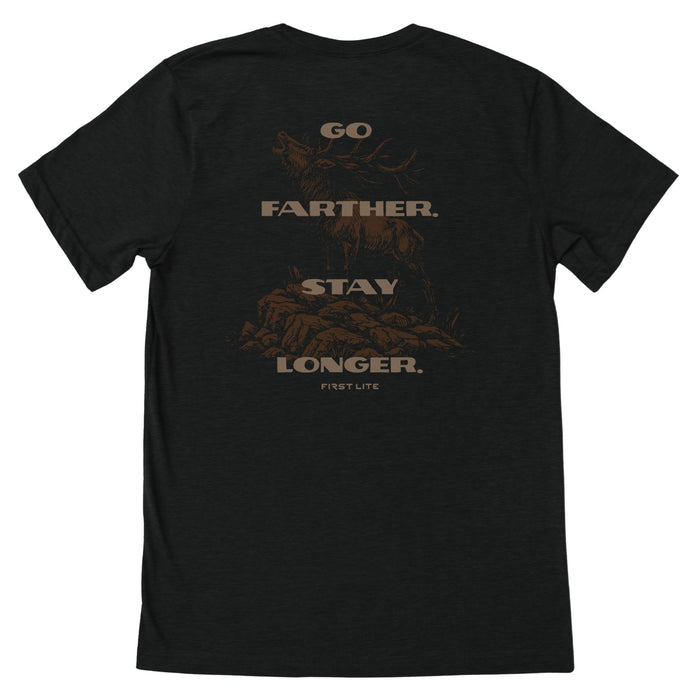 Black T-Shirt with brown text "GO FARTHER. STAY LONGER." and "FIRST LITE" with a brown elk in the background.