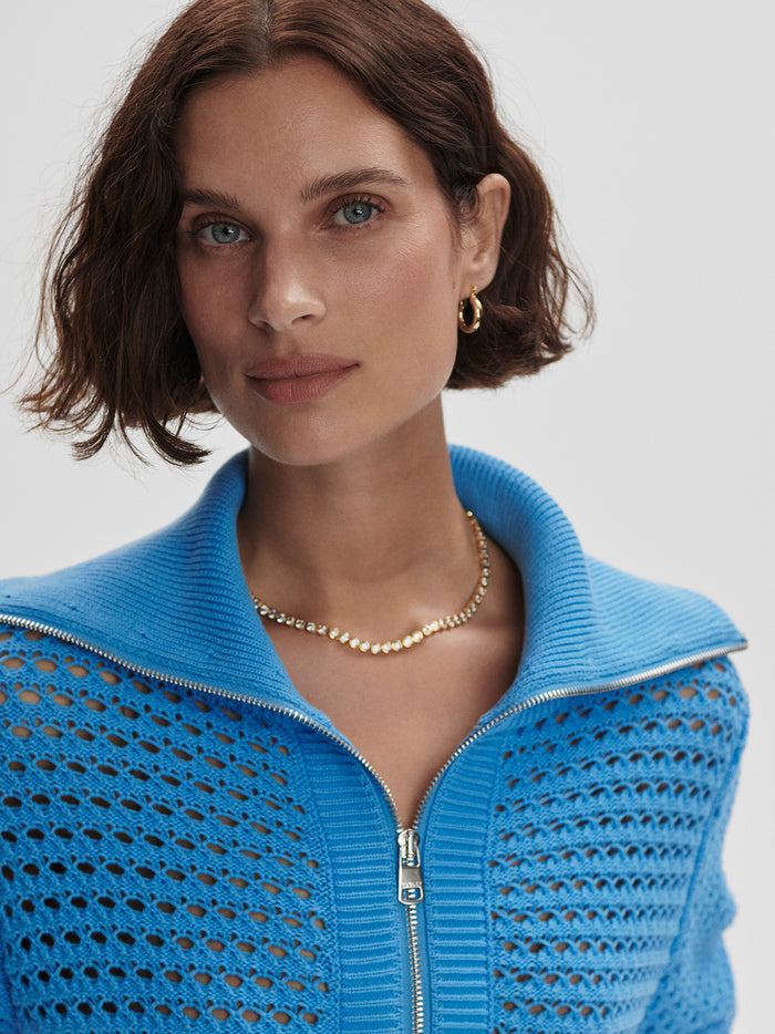 Azure Blue|Front view of the Eloise Full Zip Knit in Azure Blue, a long-sleeve knit with a full-zip closure in soft textured fabric.