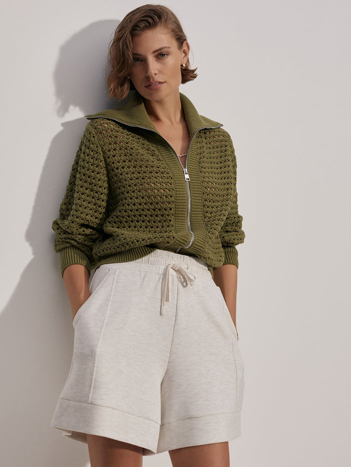 |Front-facing view of the Eloise full-zip knit in Fresh Fern, a green knit featuring a full zipper.