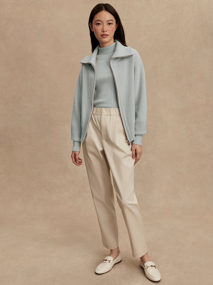 Winter Sky|Front-facing product image of the Enrico Knit Jacket in Winter Sky, a light blue knit jacket with long sleeves and a textured knit finish.