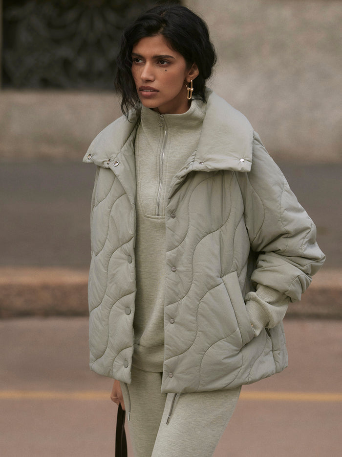 Shadow|Fabia Quilted Jacket in Superlight Soft Nylon with angled onion quilt, high collar, curved hem with cinch, snap-through, relaxed boxy fit.