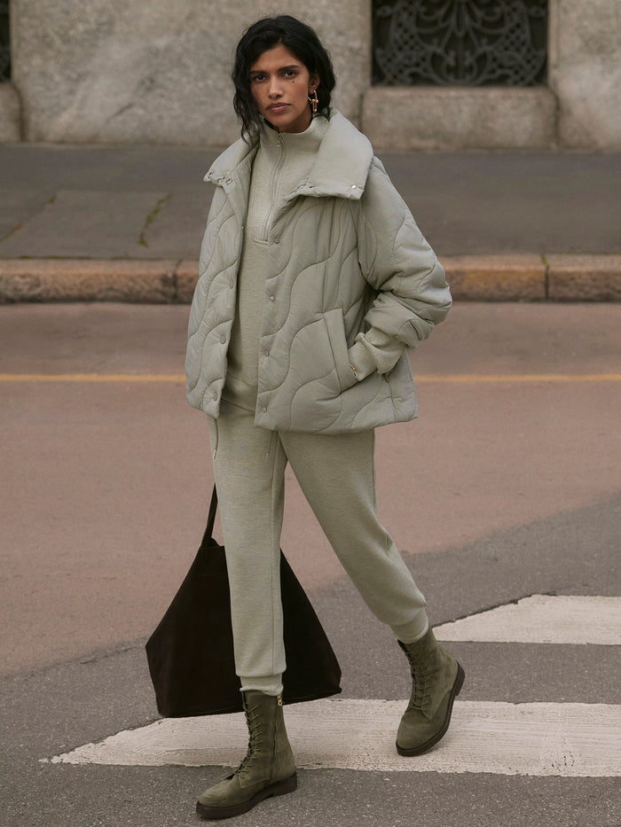 Shadow|Fabia Quilted Jacket in Shadow, front view showing a sleek quilted shell with stitched panels and lightweight warmth.