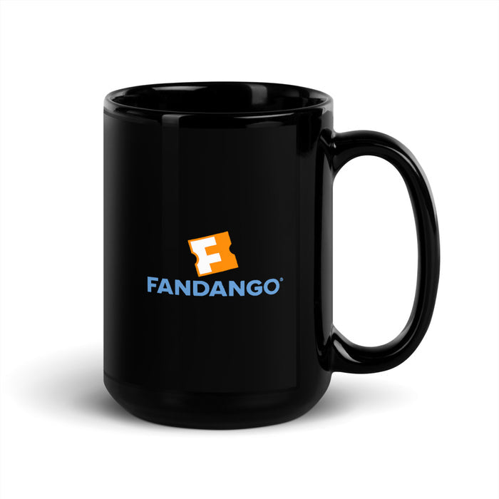 Lifestyle setting showing the Fandango ceramic mug filled with coffee next to movie snacks