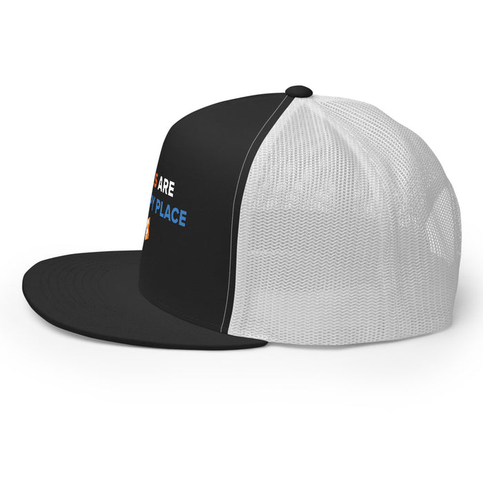 Side view of the black and white snapback trucker hat showing the breathable mesh back panels and adjustable strap