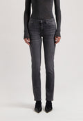Slim-fit dark gray denim jeans styled with long-sleeve charcoal top and black pointed shoes, showcasing modern casualwear.