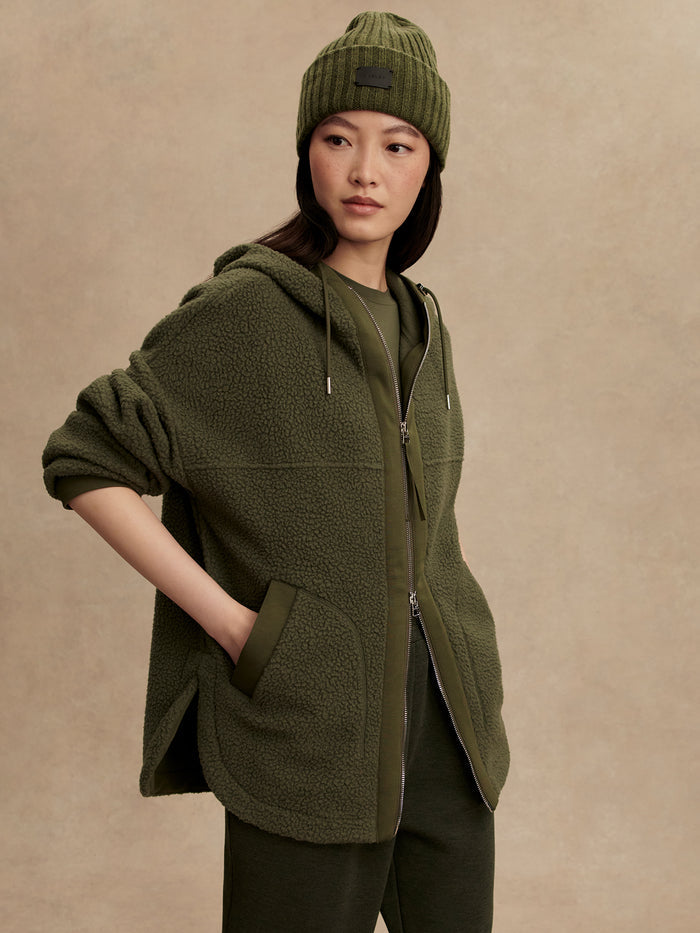 Racing Olive|Fey Relaxed Fleece in Racing Olive, hooded, DoubleSoft® fleece, curved hem, dye-to-match drawcords, Varley zip pull, pockets.