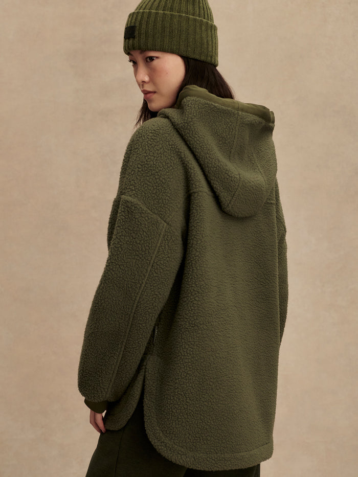 Racing Olive|Front-facing image of the Fey Relaxed Fleece Racing Olive top in olive, a relaxed-fit fleece garment with soft fabric.