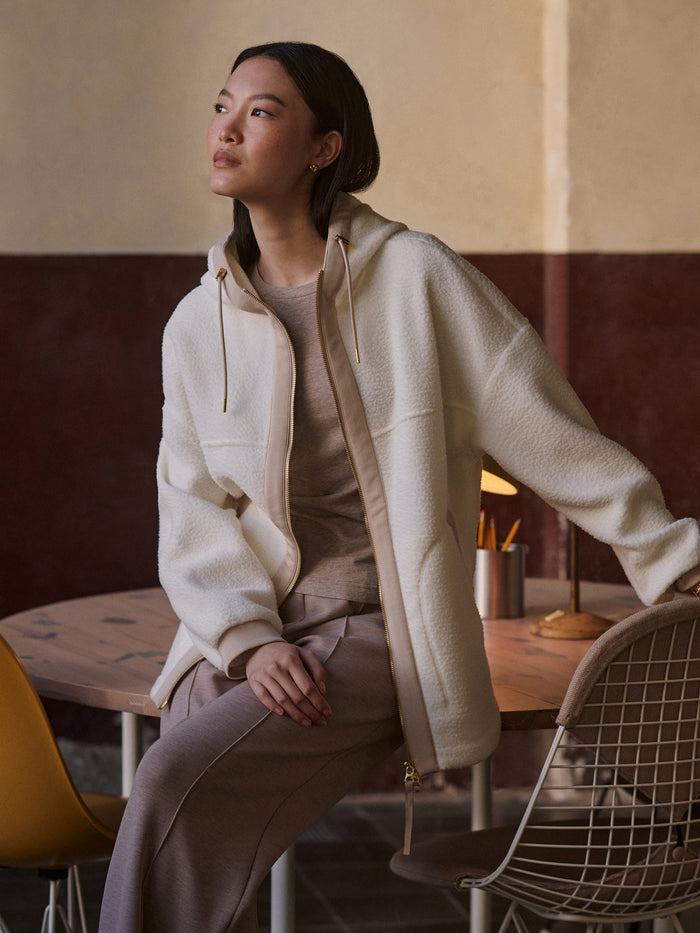 Egret|Front view of the Varley Fey Relaxed Fleece in Egret, a soft off-white fleece pullover with a relaxed fit and crew neckline.