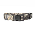 A camouflage dog collar with a black plastic quick-release buckle, shown against a plain white background. The collar features a woodland camo pattern in shades of green, brown, and beige.