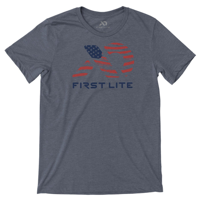 Slate grey t-shirt with a distressed red and blue logo featuring American flag stars and stripes, and 'FIRST LITE' text on the front.