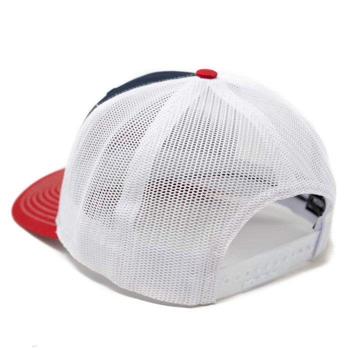 Rear view of a navy blue and red trucker hat with a white mesh back and adjustable snap closure.