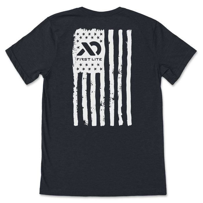Charcoal t-shirt with a distressed white American flag graphic, featuring the First Lite logo within the star field.
