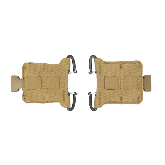 A pair of tan tactical gear adapters, each with a side-release buckle on one end and two black J-hooks on the other.