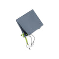 Folded slate gray tent footprint with bright green webbing and black cords.