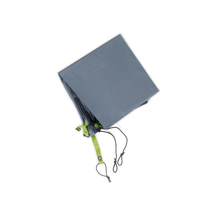 Folded slate gray tent footprint with bright green webbing and black cords.