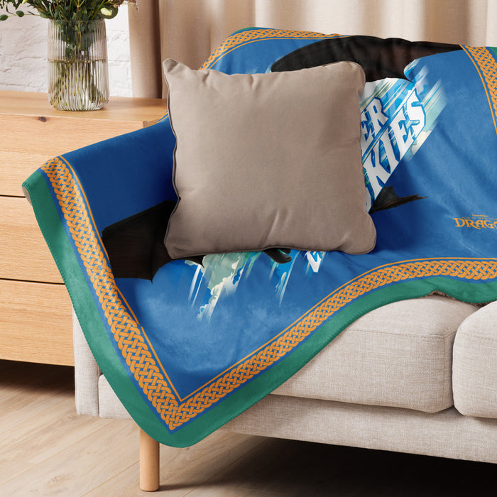 Lifestyle shot of the sherpa blanket draped over an armchair in a cozy living room