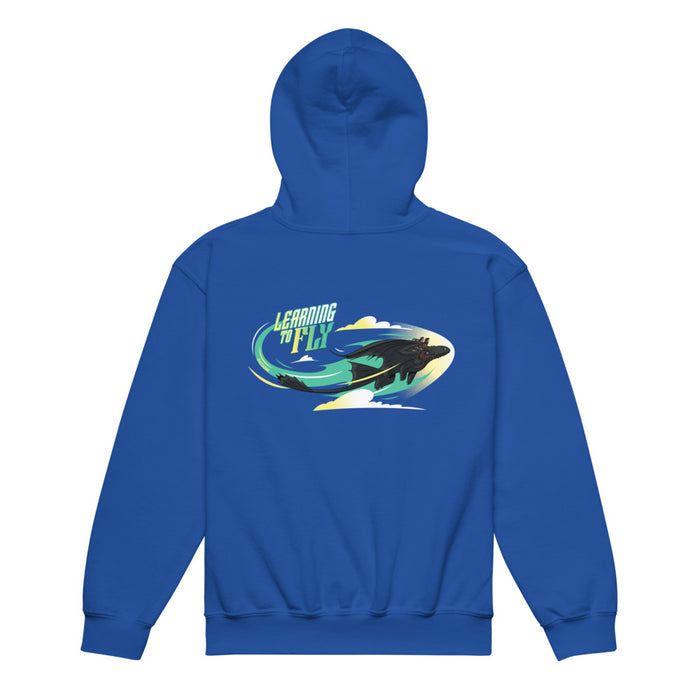 Close-up view of the Learn To Fly graphic detail on the front of the royal blue youth hoodie