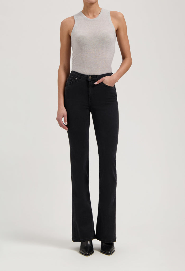 Ribbed gray sleeveless top paired with black high-waisted bootcut jeans and black ankle boots.