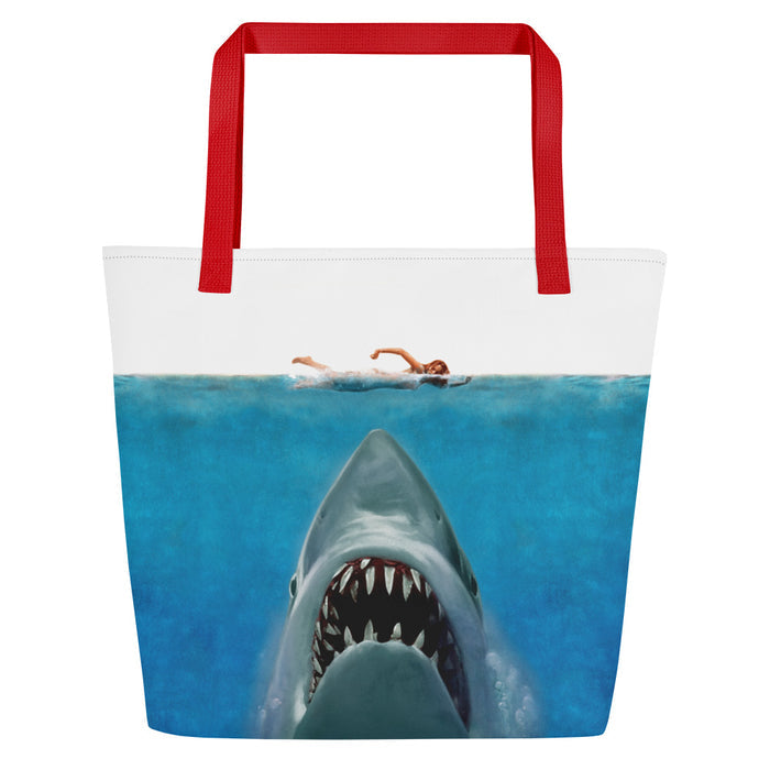 Front view of the Jaws 50th Anniversary beach bag in red with a vibrant two-sided movie graphic